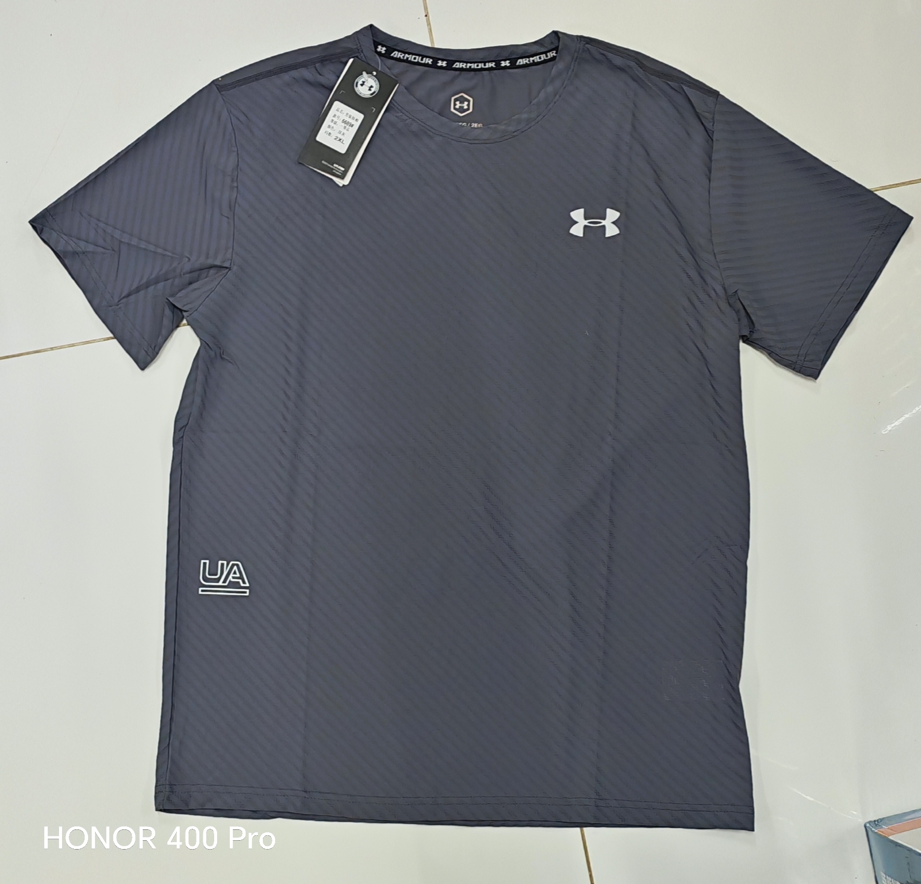 IMG_20260816_183442_edit_248114519220559 TSHIRT UNDER ARMOUR رصاصي - الصورة 1